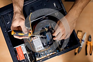 Technician fixing problem with PC .computer maintenance technician,