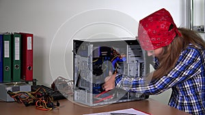 Technician girl upgrading desktop pc ram.