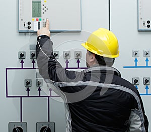 Technician give command in power plant control center