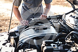 Technician hands of car mechanic in doing auto repair service and maintenance worker repairing vehicle with wrench, Service and