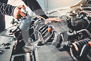 Technician Hands of car mechanic working in auto repair Service and Maintenance car