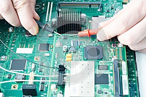 Technician hands with voltmeter