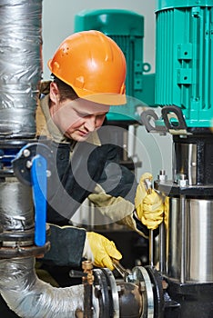 Technician of heating system in boiler room