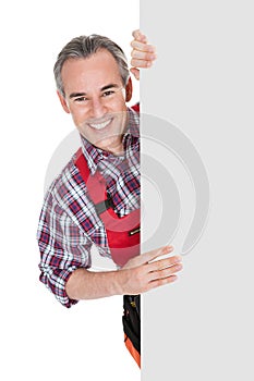 Technician holding blank placard