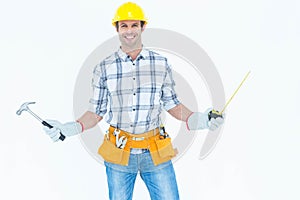 Technician holding hammer and measure tape