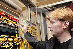 Technician holding optical connector