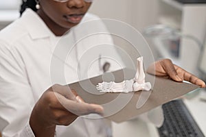 Technician Holding Print Bed with 3D Anatomical Sample