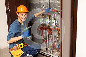 Technician inspecting heating system in boiler room