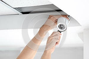 Technician installing CCTV camera