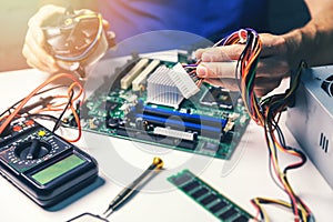 Technician installing computer hardware components