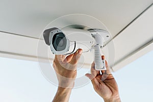 Security Camera Installation on Ceiling by Technician for Surveillance System