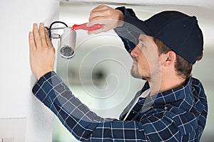 technician installing video surveillance camera