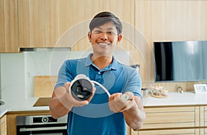 A technician installs a CCTV camera in a modern apartment.