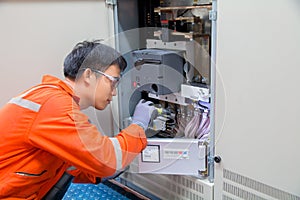 Technician,Instrument technician on the job calibrate or function check pneumatic control valve in process oil and gas platform o