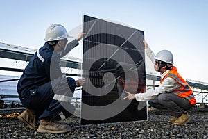 Technician is lifting the solar cell to replace the damaged one, Alternative energy to conserve the world`s energy, Photovoltaic