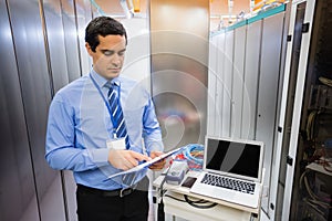 Technician looking at checklist