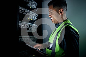 Technician man, check and tablet in server room inspection, thinking or smile for analysis, night or programming