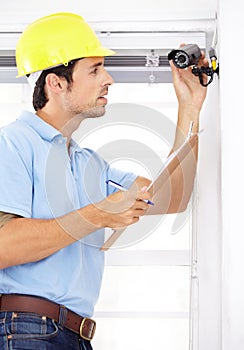 Technician man, clipboard and security camera for home CCTV installation and documents for safety or maintenance