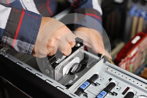 Technician man fix or upgrading hard disk on computer