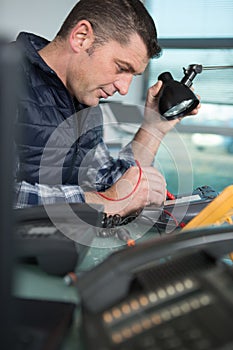 technician man repairing electronic device