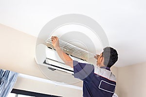 Technician man service for cleaning air conditioner, Repairman washing dirty compartments air conditioning, Maintenance and