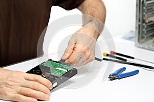 Technician person is repairing a computer