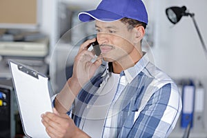 technician on phone at warehouse