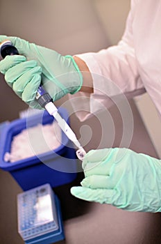 Medical Testing Equipment and Hands Holding Test Tubes