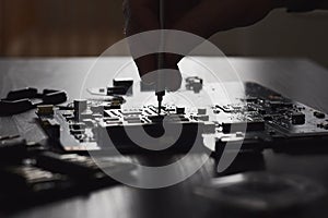 Technician plug in CPU microprocessor to computer motherboard