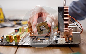 Technician plug in microprocessor to motherboard