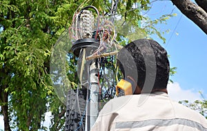 Technician is plugging in a network cable