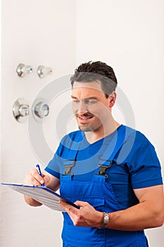 Technician reading the water meter