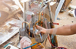 Technician repair air conditioner by vacuum at maintenance shop