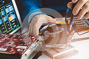 Technician repairing broken hard disk drive