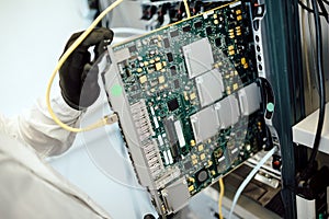 Technician repairing cmts cards