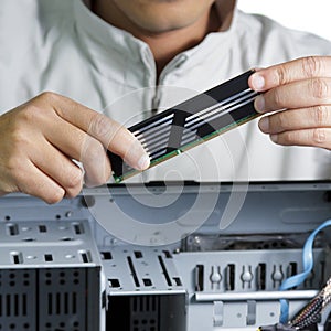 Technician repairing computer hardware