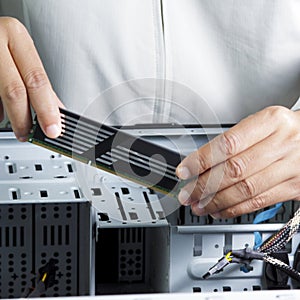 Technician repairing computer hardware
