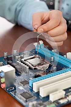 Technician repairing computer hardware in the lab