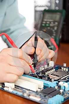 Technician repairing computer hardware in the lab