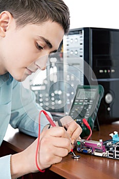 Technician repairing computer hardware in the lab