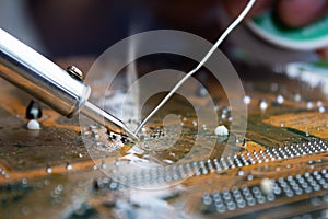 The technician repairing the computer mainboard