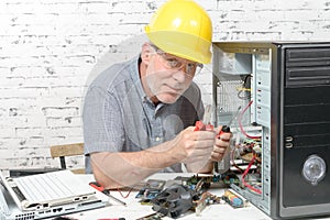 A technician repairing a computer