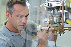 technician repairing electric boiler