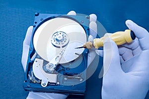 Technician repairing an hard disk