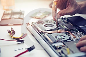 technician repairing laptop computer