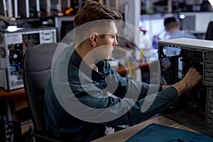 Technician Repairing Motherboard from PC. Repair Shop. Computer Hardware.