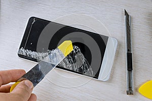 Technician repairing smartphone by in the mobile phone electronic repairing technology