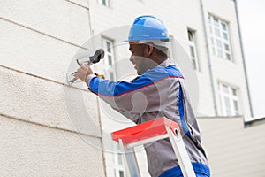 Technician Repairing Surveillance Camera