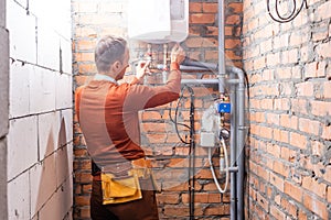 Technician servicing an hot-water heater.