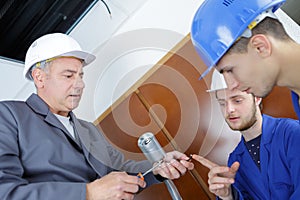 Technician talking to cctv apprentices photo